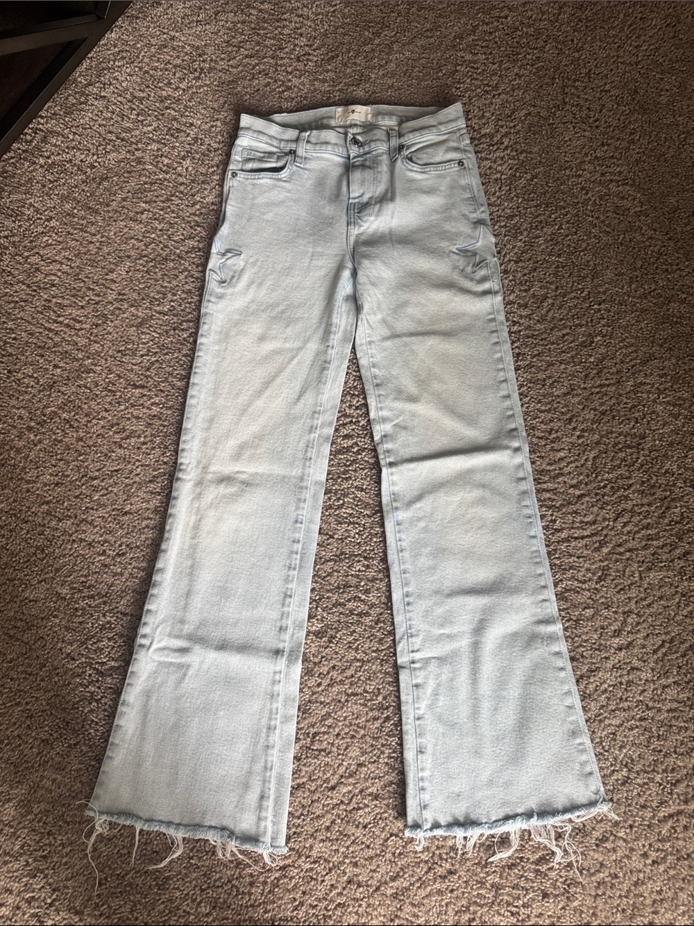 7 For All Mankind Light Blue Flare Jeans with Frayed Hem and Star on each hip